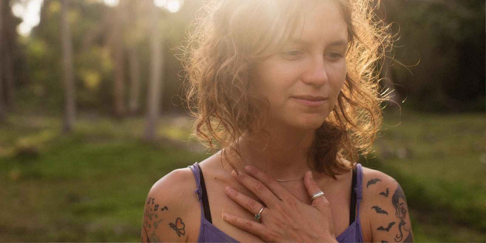 A woman recognising her shortness-of-breath symptoms, staying calm, and taking control of her breathing.