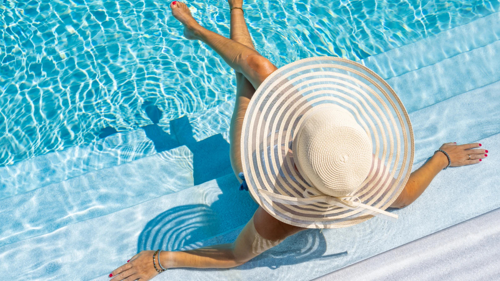 Woman taking a break after swimming in a pool