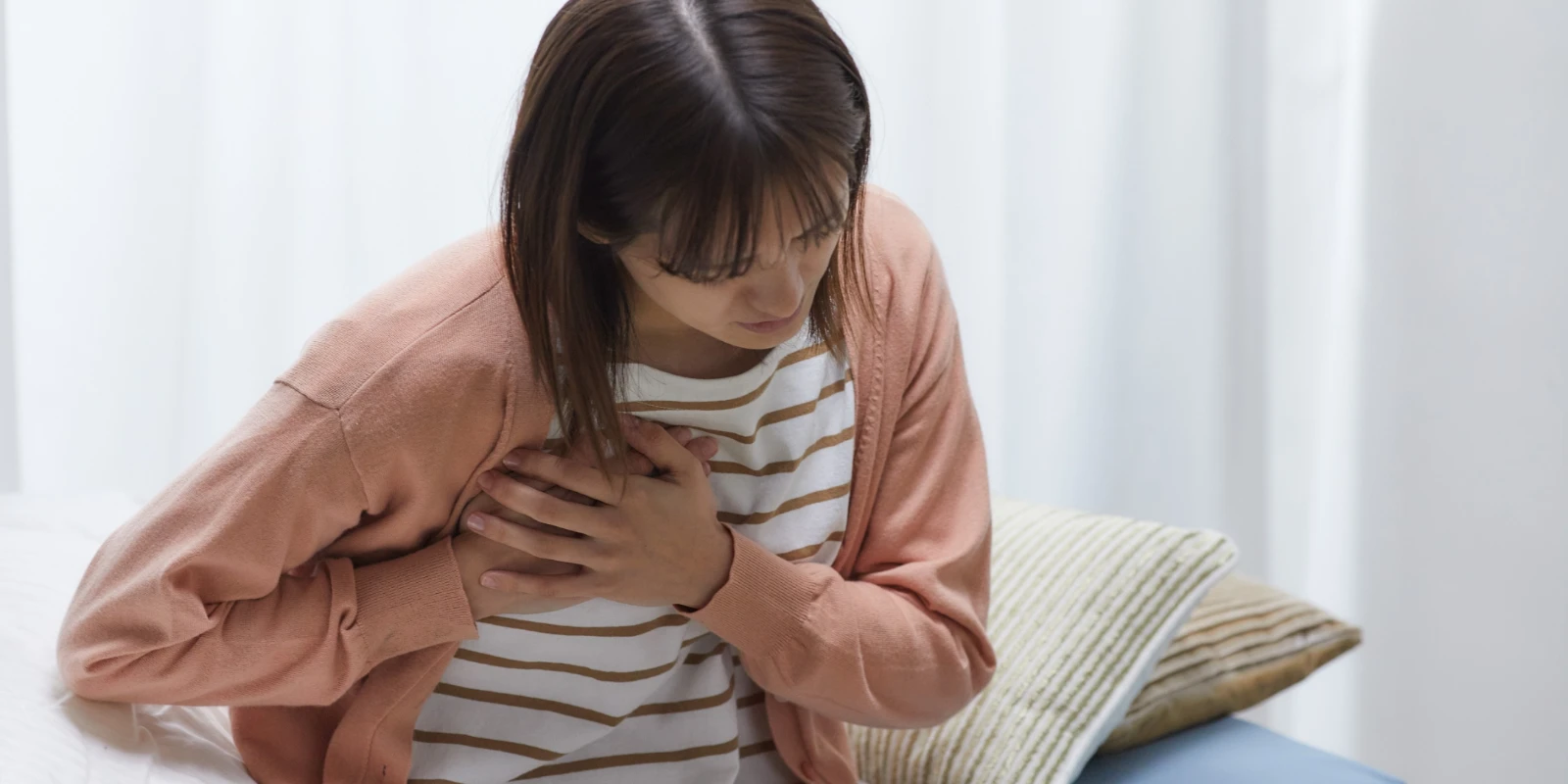 A woman experiencing shortness of breath.