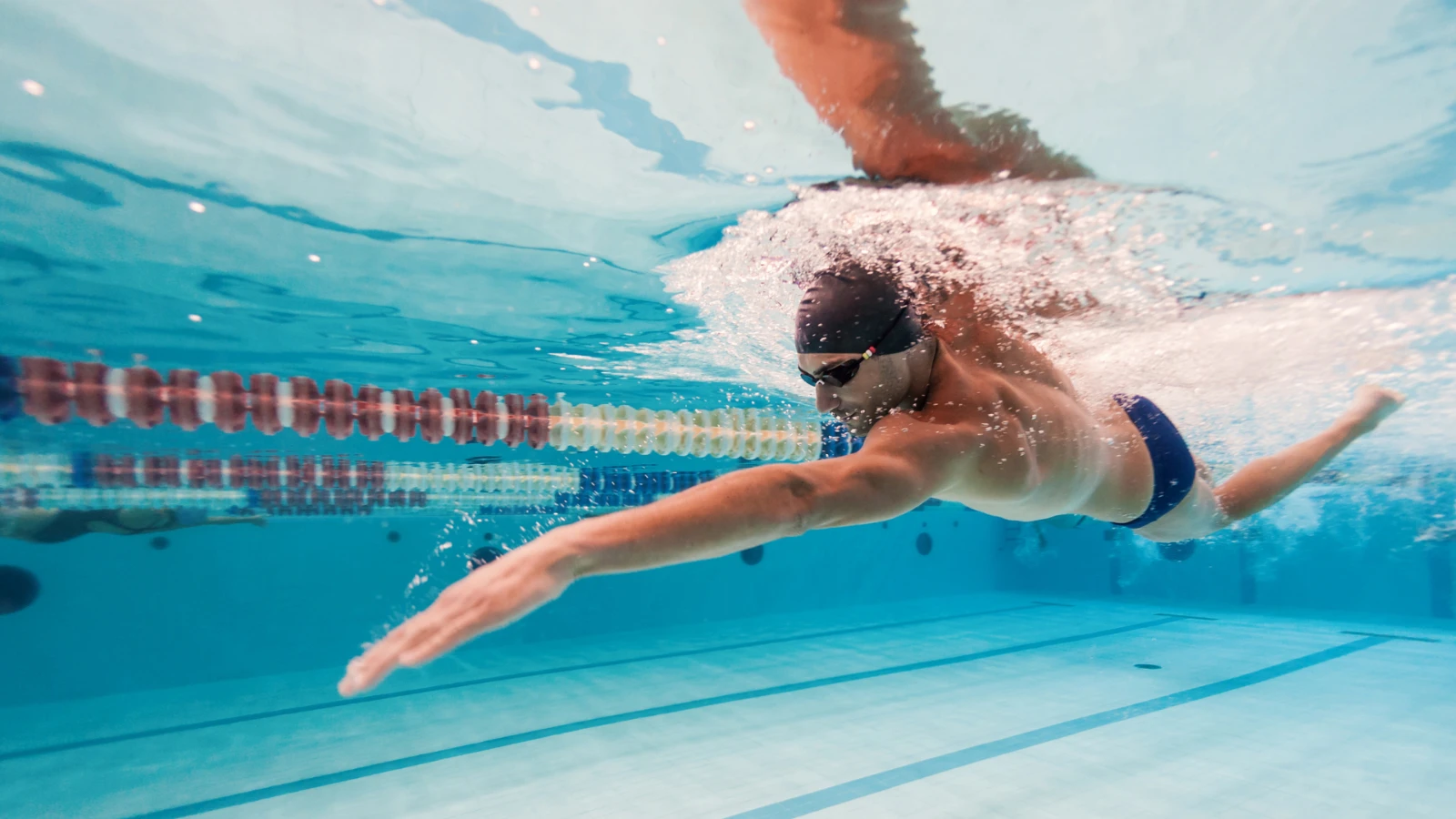 Swimmer turning their head to breathe while swimming