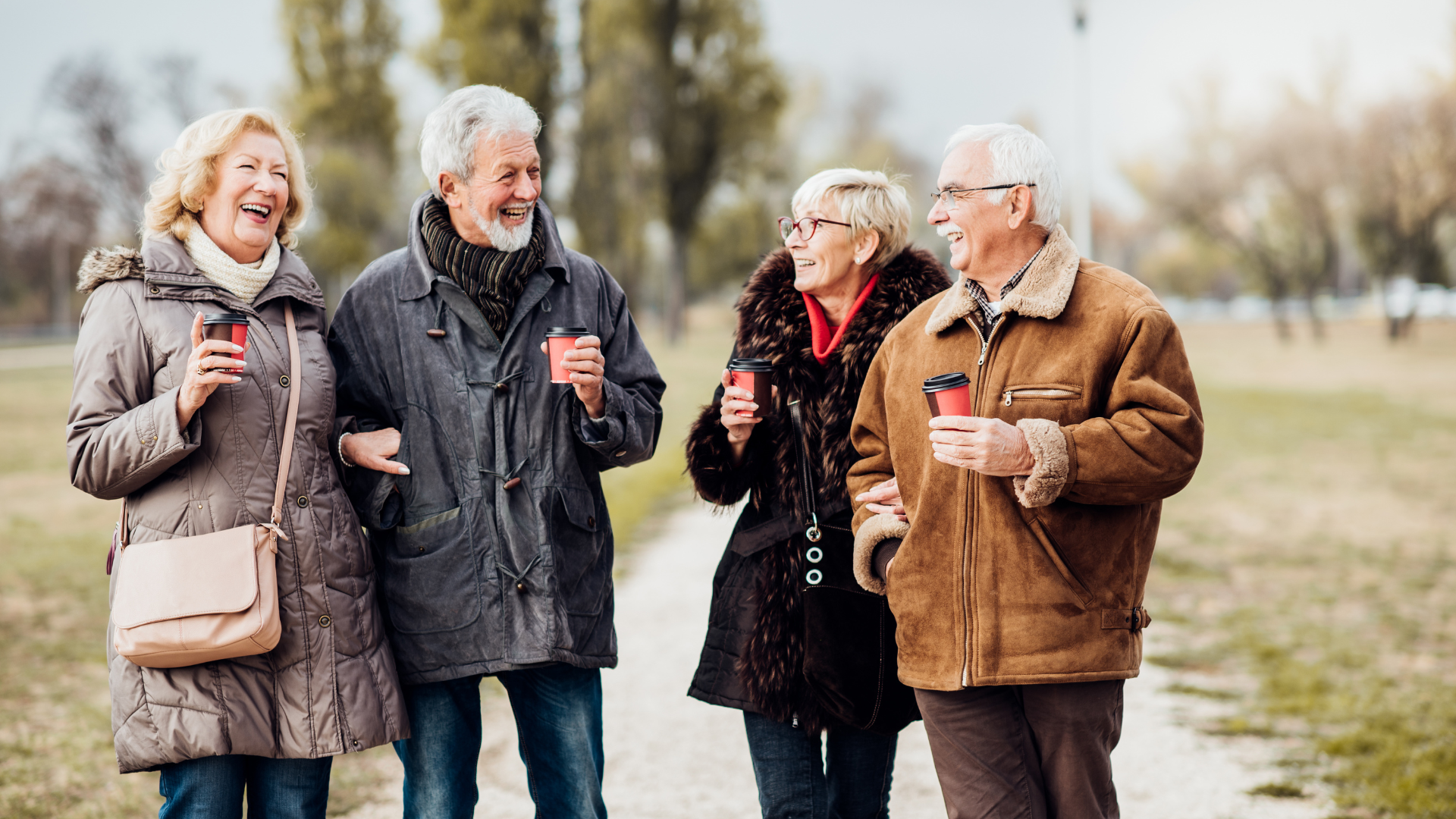 Seniors smiling outdoors, while staying active and monitoring COPD symptoms.