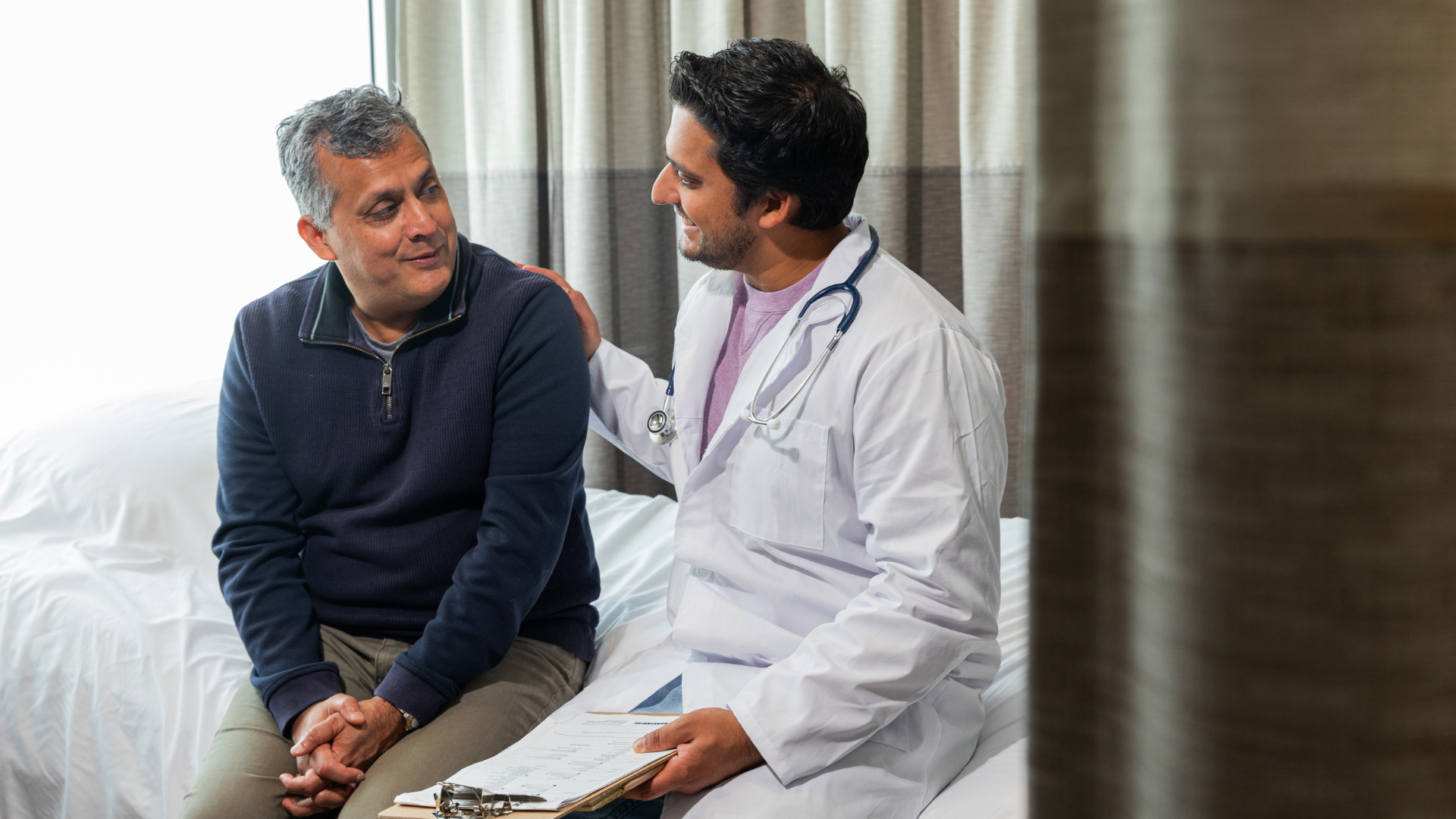Adult speaking with a doctor about lung screening and early diagnosis.