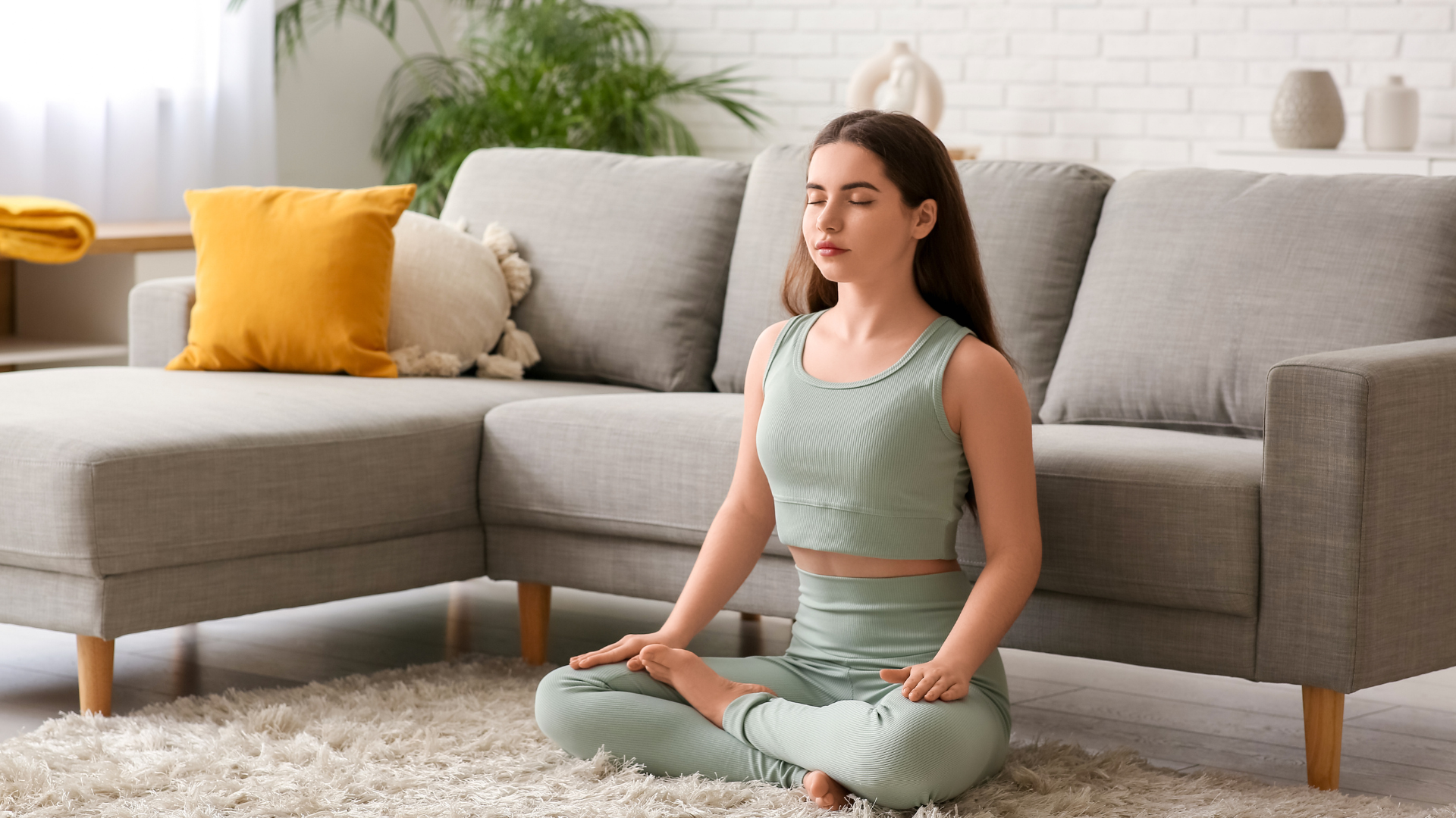 Person using a calm breathing routine at home.