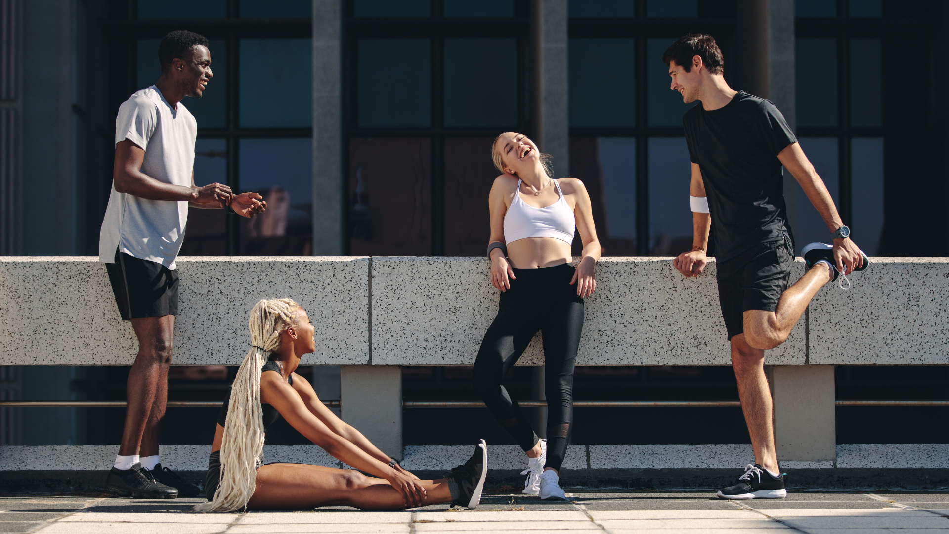 Group of friends breathing fresh air outdoors after deciding to stop smoking.